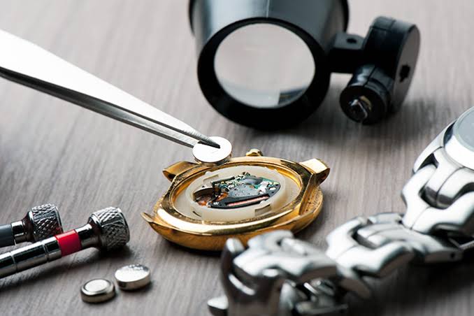 Watchmaker servicing a luxury watch movement in Dubai